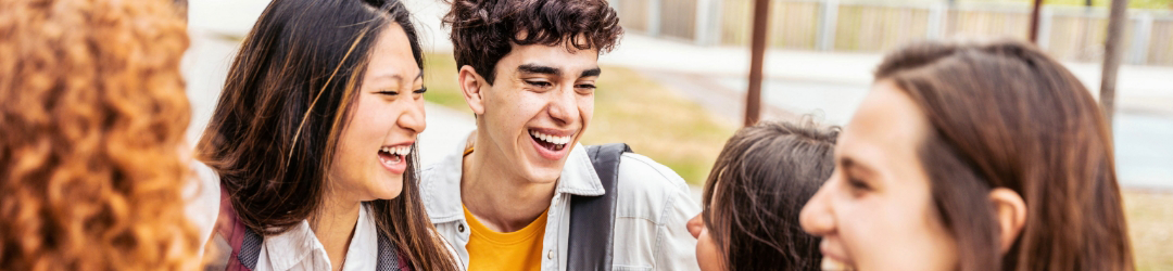 young adults laughing together at school